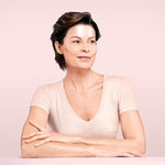 Model wearing anti wrinkle patches on her forehead