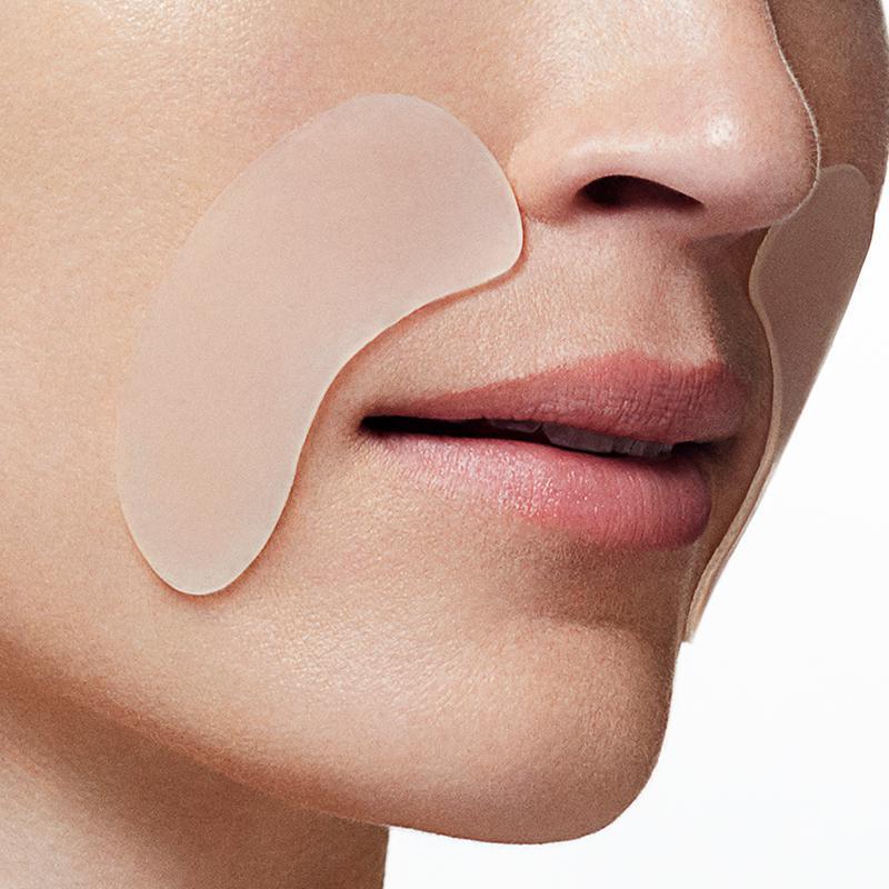 close up of a Model wearing SiO anti wrinkle silicone patches