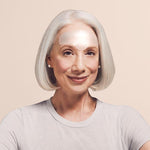 Model wearing anti wrinkle patches on her forehead