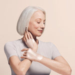 Model wearing SiO anti wrinkle patches on hands